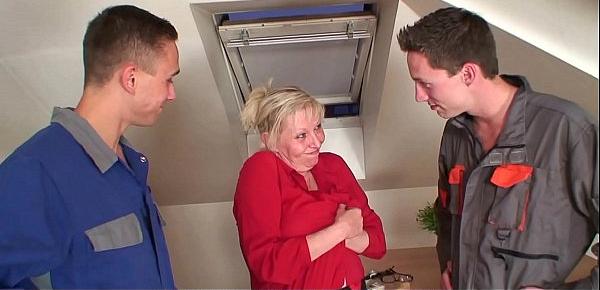  Two workers screw busty blonde grandma